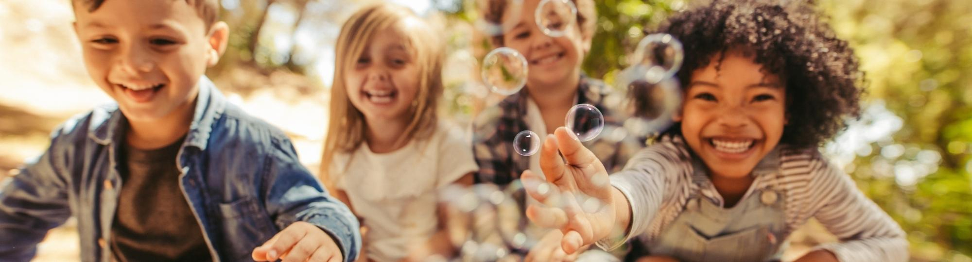 Group of kids playing with bubbles