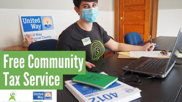 Woman at computer wearing face mask