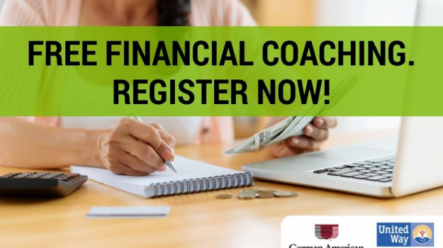 Woman writing in notebook while holding money