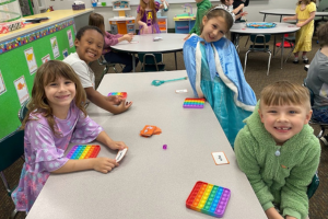 Group of elementary kids at table