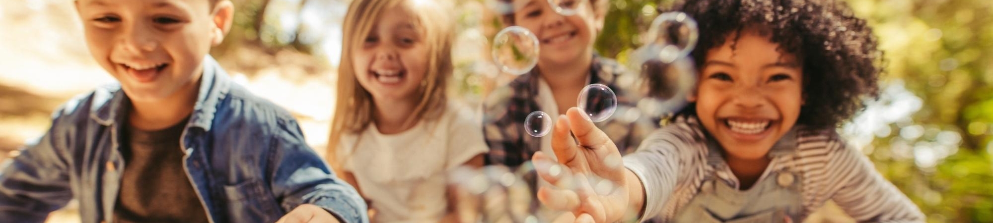 Group of kids playing with bubbles