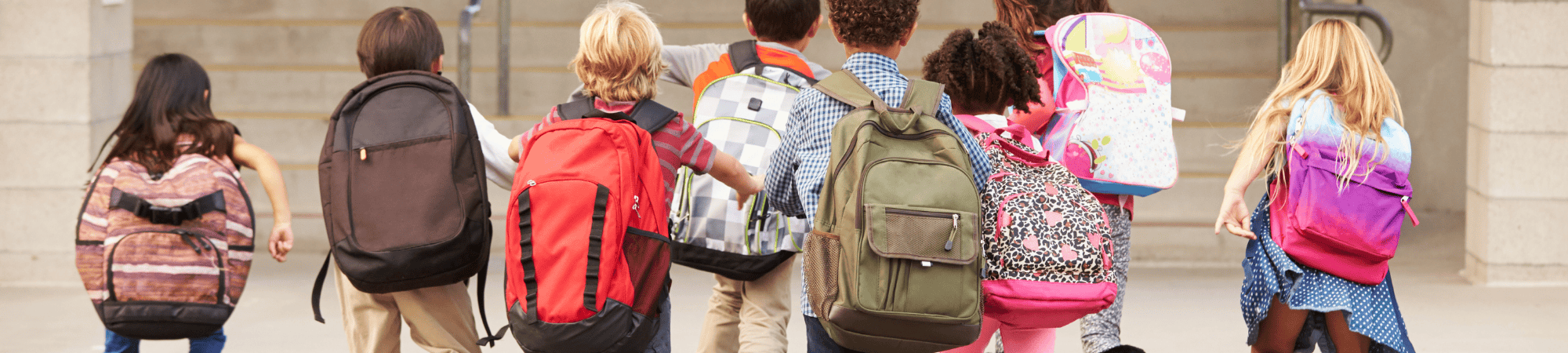 Young kids walking into school