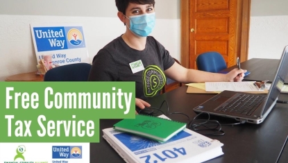 Woman at computer wearing face mask