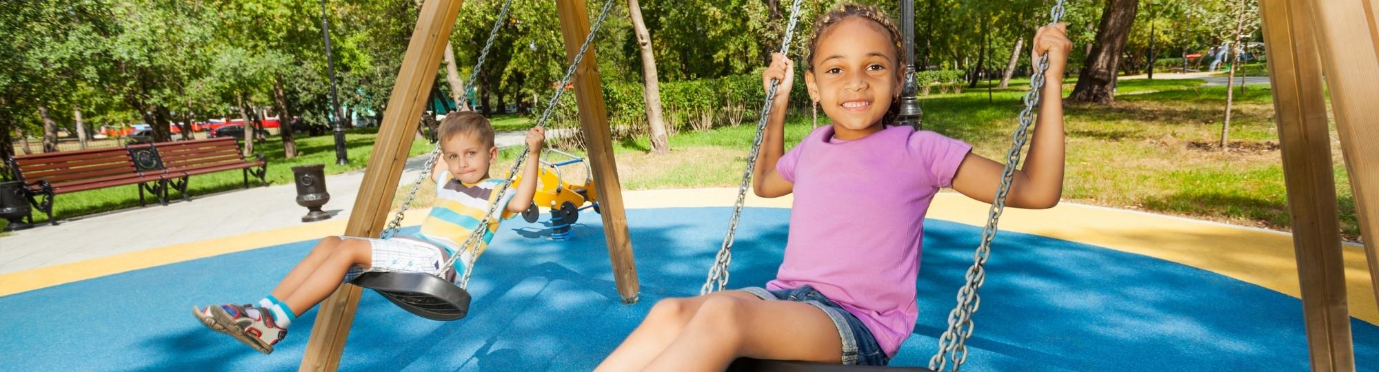 Young children on swings